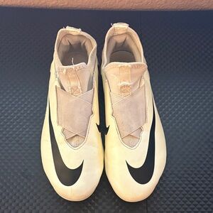 Nike Cream Athletic Cleats with Black Swoosh